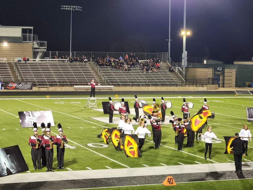 The Panther Marching band performing on a football field in Jennison, Michigan