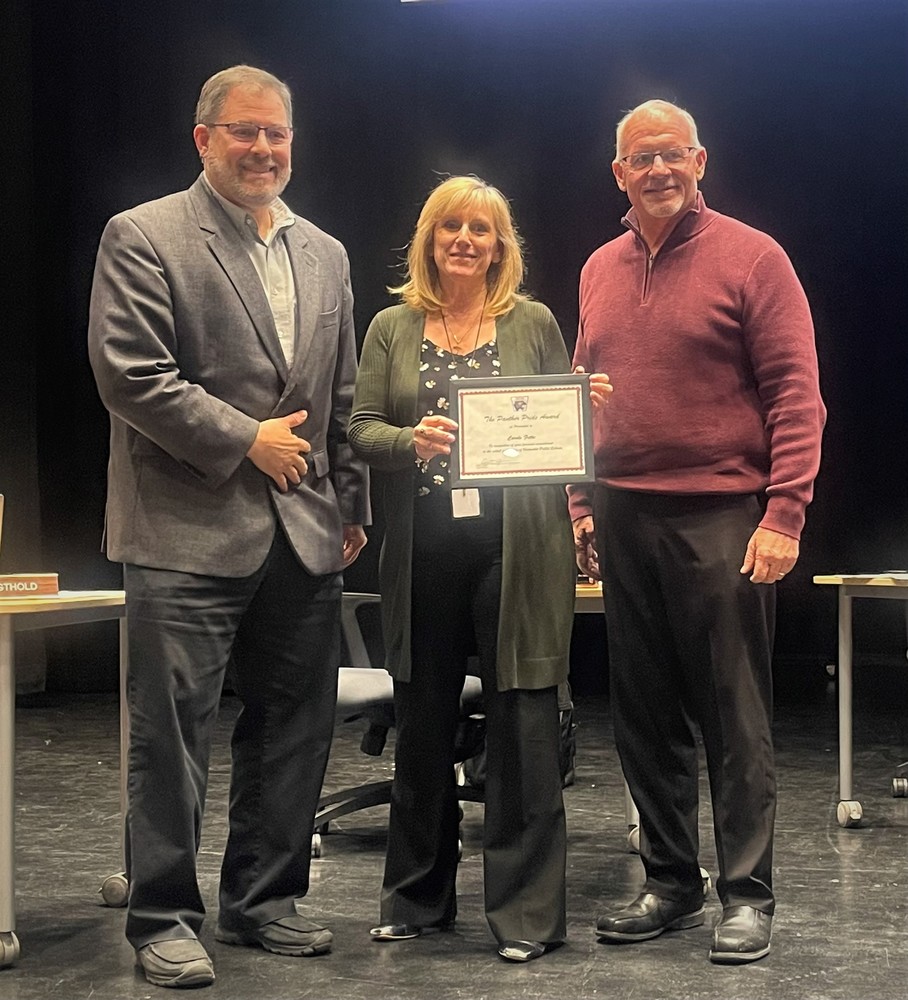 Superintendent Ric Seager and Board of Ed. President Bill Spaulding presenting The Panther Pride Award to North Elementary School Principal Carole Fetke