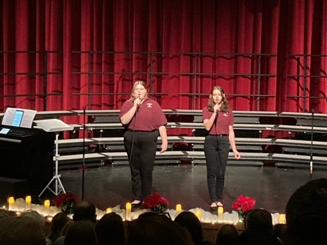 Two female members of the WHS Choir perform a duet