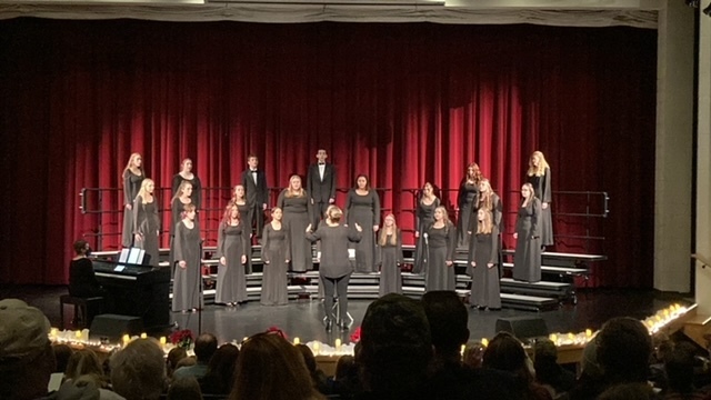 A smaller group of choir members sing.