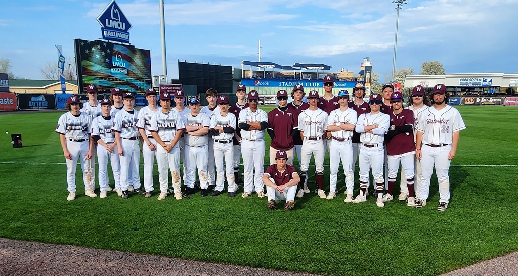 Watervliet Panther Baseball Teams stand on the grass at LMCU Ballpark posing for a combined JV and Varsity Team photo