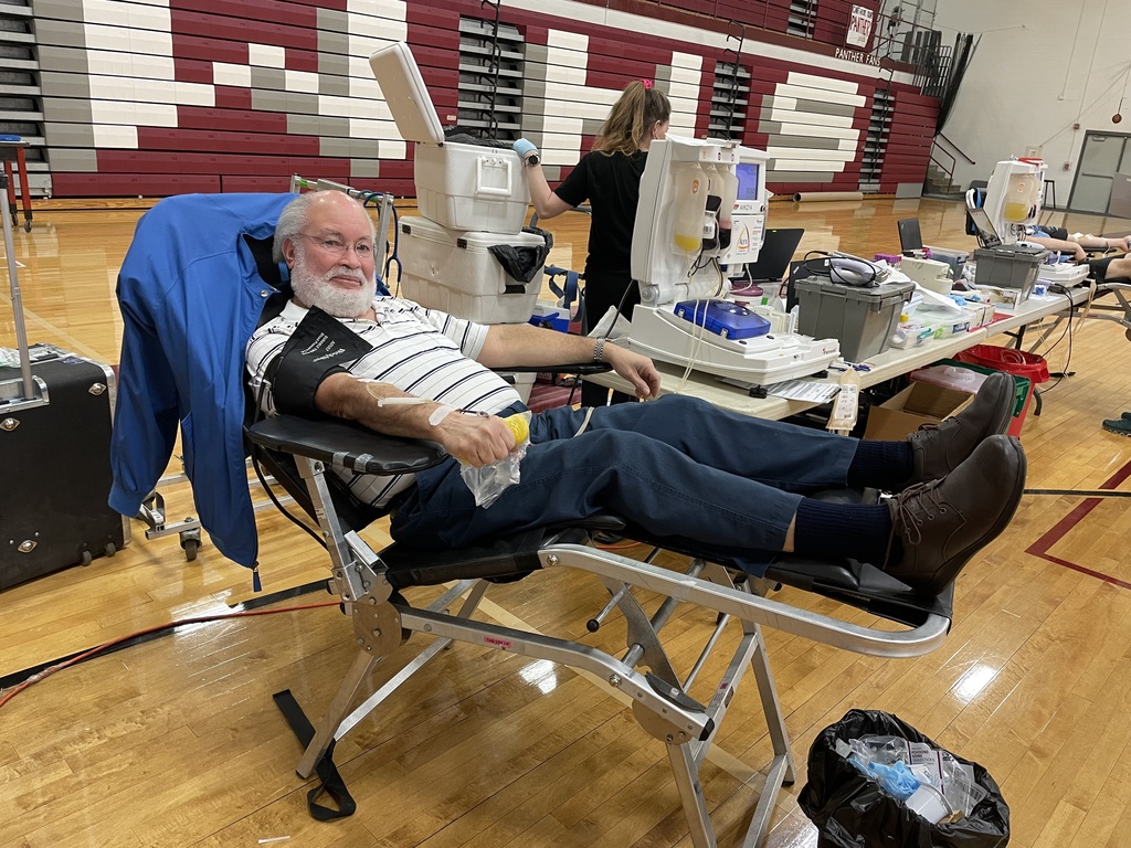 older man giving blood